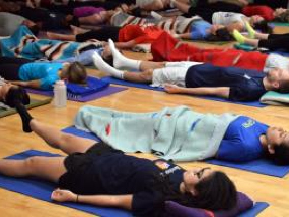 Students lying on floor during yoga