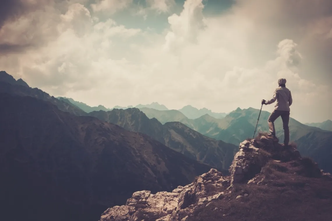 woman on mountain peak